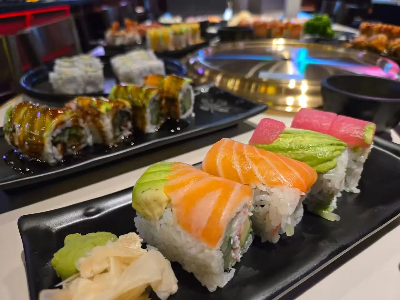 Sushi platter with salmon avocado rolls and tuna avocado rolls, served with wasabi and ginger at Daruma BBQ & Sushi AYCE, a Asian Restaurant in Holyoke